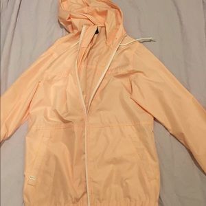 Coral colored rain jacket